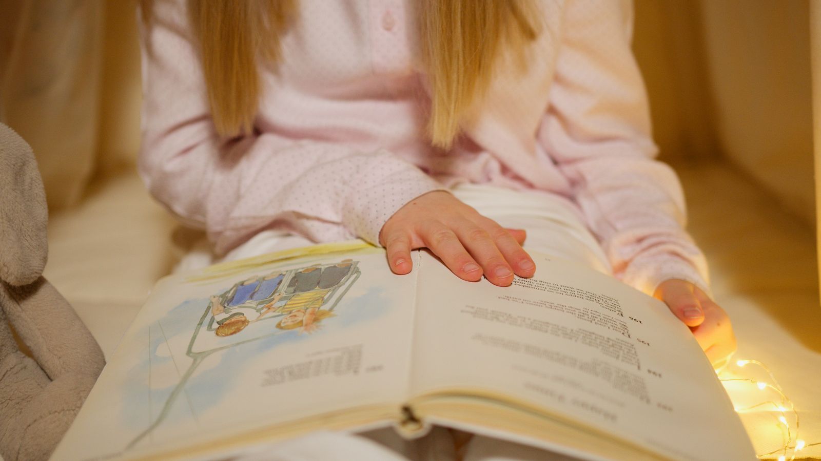 A child reading a storybook
